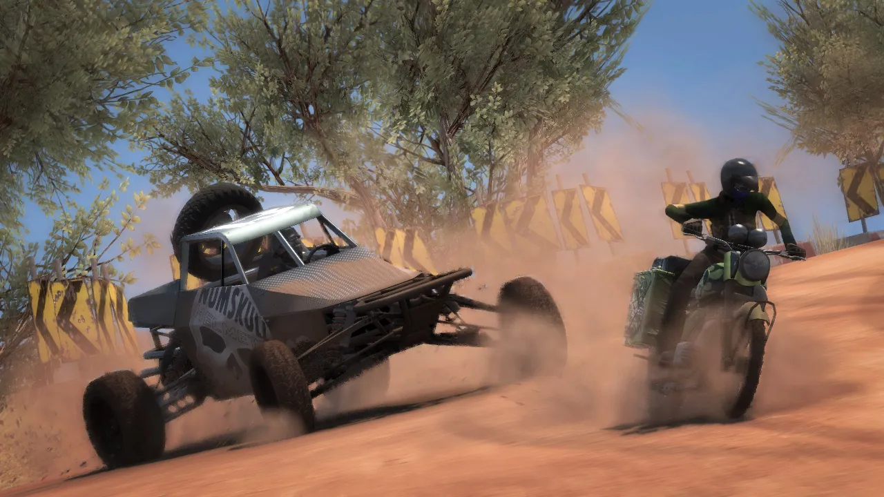 A buggy and a bike create lots of dust