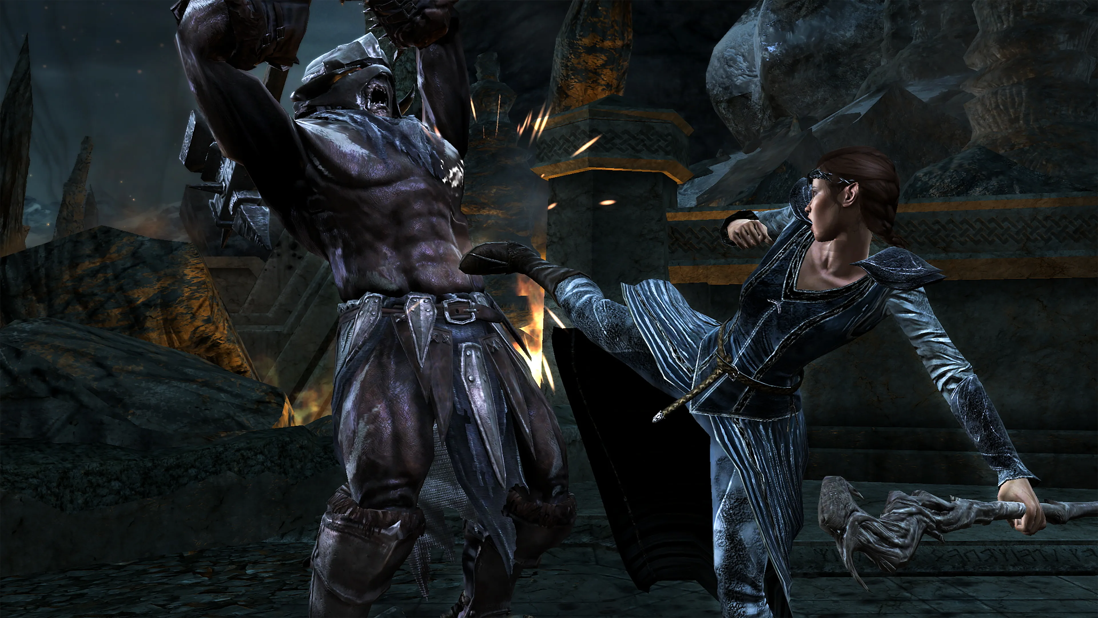 The female mage hick kicks an orc.